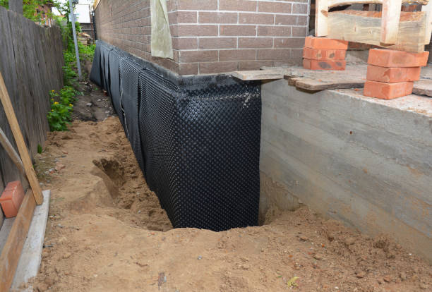 Happy homeowners after waterproofing job in Wood-Ridge